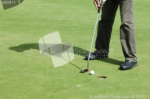 Image of Final putt on golf course