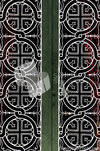 Image of church door iron pattern