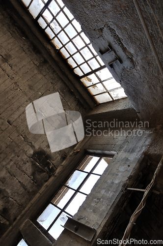 Image of broken windows concrete wall and ceiling