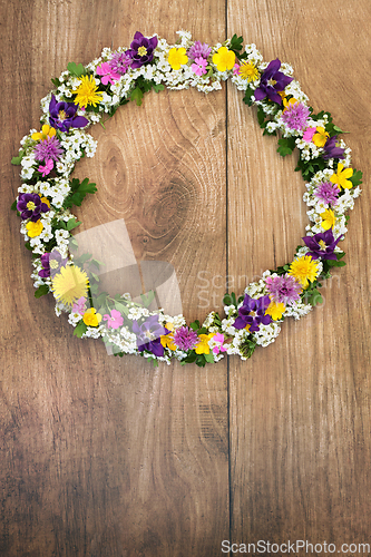 Image of Natural Spring Flower Wreath on Rustic Wood Background