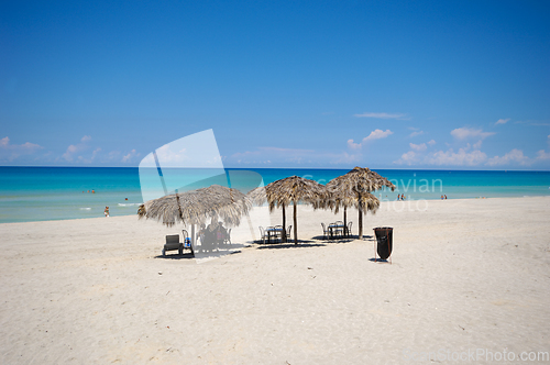 Image of Tropical beach with parasols