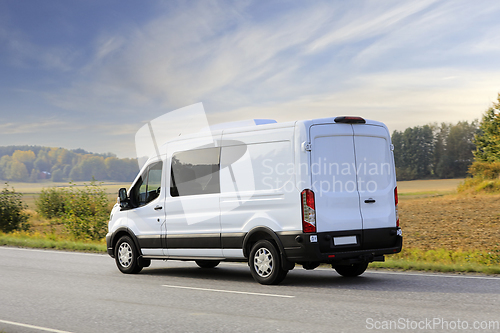 Image of White Van at Speed on Highway