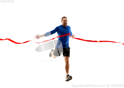 Image of Caucasian professional runner, jogger training isolated on white studio background in fire