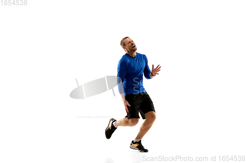 Image of Caucasian professional runner, jogger training isolated on white studio background in fire