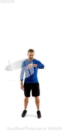 Image of Caucasian professional runner, jogger training isolated on white studio background in fire