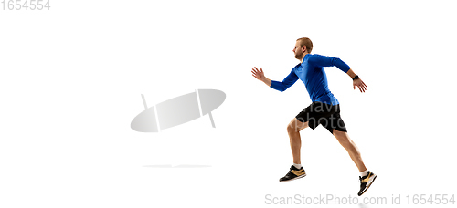 Image of Caucasian professional runner, jogger training isolated on white studio background in fire