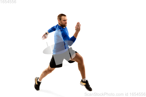 Image of Caucasian professional runner, jogger training isolated on white studio background in fire