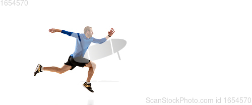 Image of Caucasian professional runner, jogger training isolated on white studio background in fire