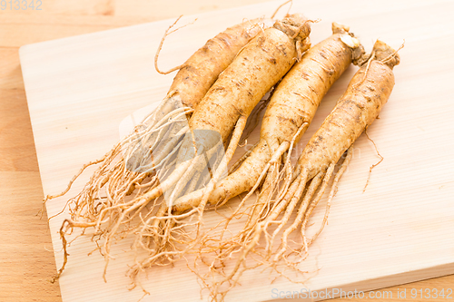 Image of Ginseng over wood background