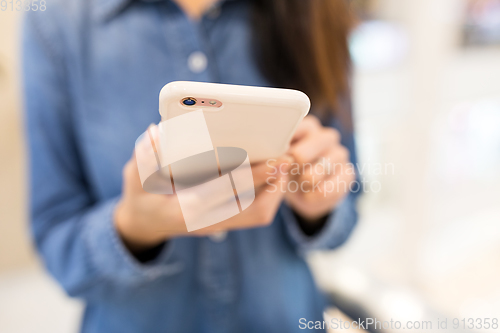 Image of Woman use of mobile phone