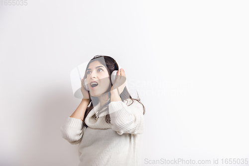 Image of Portrait of beautiful woman isolated on white studio background. Comfort, warm in winter concept