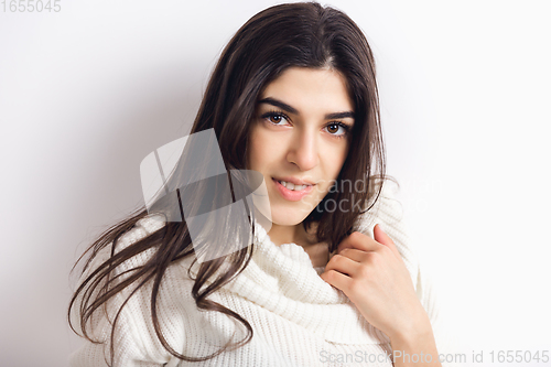 Image of Portrait of beautiful woman isolated on white studio background. Comfort, warm in winter concept