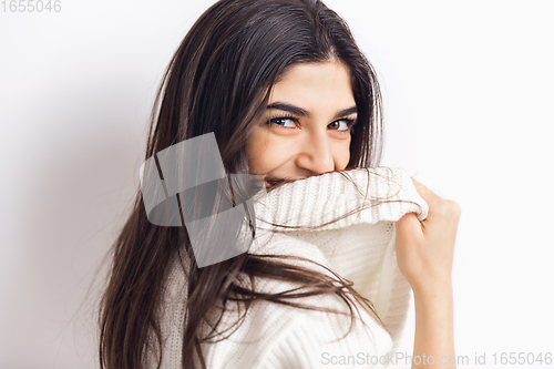 Image of Portrait of beautiful woman isolated on white studio background. Comfort, warm in winter concept