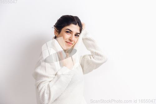 Image of Portrait of beautiful woman isolated on white studio background. Comfort, warm in winter concept