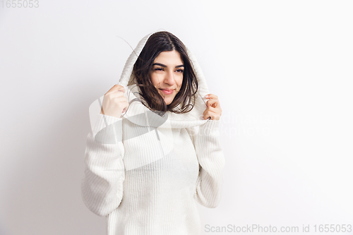 Image of Portrait of beautiful woman isolated on white studio background. Comfort, warm in winter concept