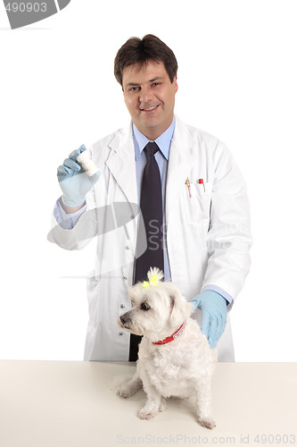 Image of Vet with bottle of pills tablets