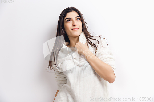 Image of Portrait of beautiful woman isolated on white studio background. Comfort, warm in winter concept