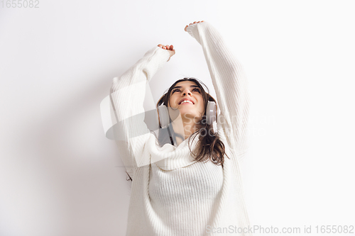Image of Portrait of beautiful woman isolated on white studio background. Comfort, warm in winter concept