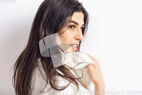 Image of Portrait of beautiful woman isolated on white studio background. Comfort, warm in winter concept