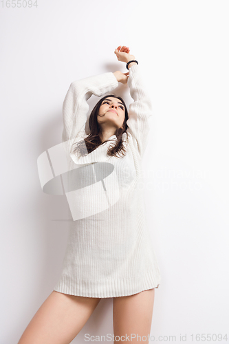 Image of Portrait of beautiful woman isolated on white studio background. Comfort, warm in winter concept