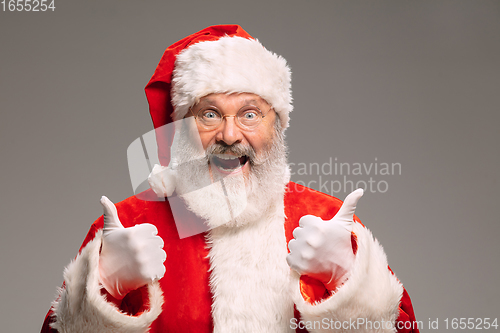 Image of Senior man like Santa Claus isolated on grey studio background