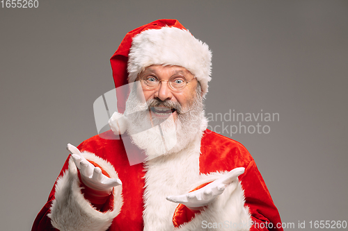 Image of Senior man like Santa Claus isolated on grey studio background