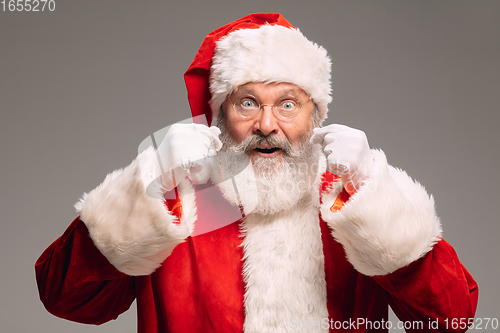 Image of Senior man like Santa Claus isolated on grey studio background