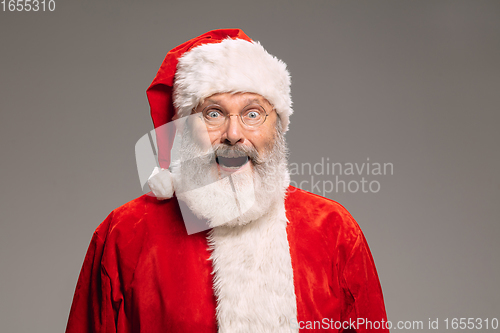 Image of Senior man like Santa Claus isolated on grey studio background