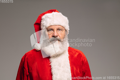 Image of Senior man like Santa Claus isolated on grey studio background