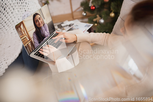 Image of Young woman enjoying her domestic life. Home comfort, winter and holidays time