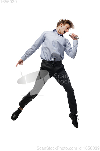 Image of Happy young man dancing in casual clothes or suit, remaking legendary moves of celebrity from culture history