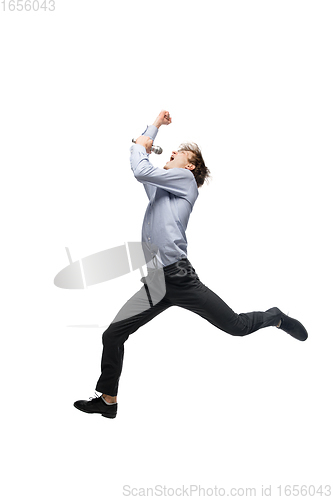 Image of Happy young man dancing in casual clothes or suit, remaking legendary moves of celebrity from culture history