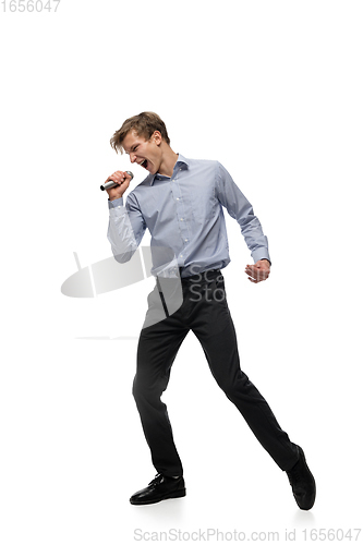 Image of Happy young man dancing in casual clothes or suit, remaking legendary moves of celebrity from culture history