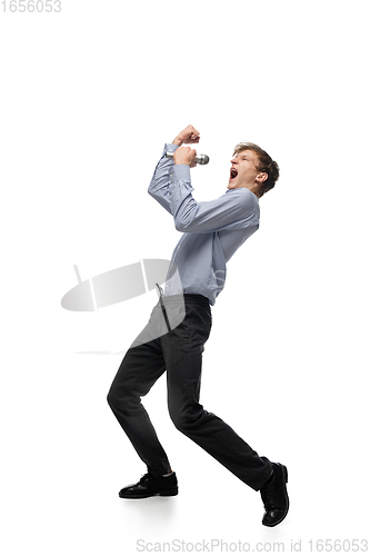Image of Happy young man dancing in casual clothes or suit, remaking legendary moves of celebrity from culture history