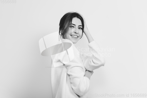 Image of Portrait of beautiful woman isolated on white studio background. Comfort, warm in winter concept