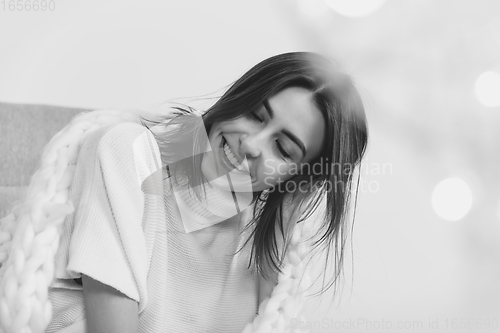 Image of Portrait of beautiful woman isolated on white studio background. Comfort, warm in winter concept