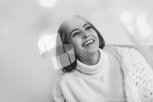 Image of Portrait of beautiful woman isolated on white studio background. Comfort, warm in winter concept