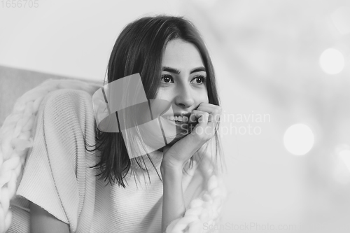 Image of Portrait of beautiful woman isolated on white studio background. Comfort, warm in winter concept