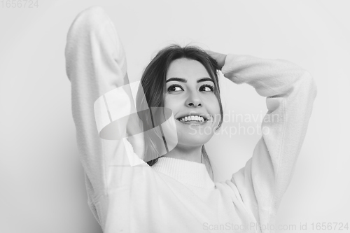 Image of Portrait of beautiful woman isolated on white studio background. Comfort, warm in winter concept