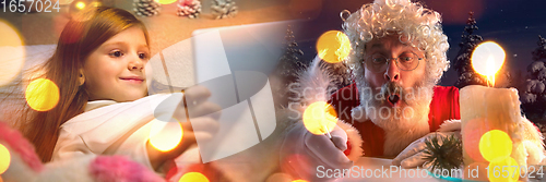 Image of Happy caucasian little girl during video call or messaging with Santa using laptop and home devices, celebration or ad flyer with copyspace