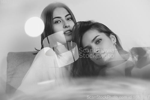 Image of Portrait of beautiful women isolated on white studio background. Comfort, warm in winter concept