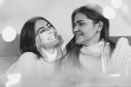 Image of Portrait of beautiful women isolated on white studio background. Comfort, warm in winter concept