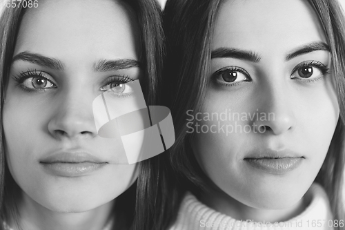 Image of Close up portrait of beautiful women isolated on white studio background. Comfort, warm in winter concept