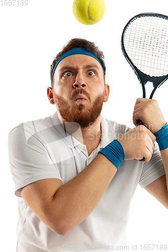 Image of Funny emotions of professional tennis player isolated on white studio background, excitement in game