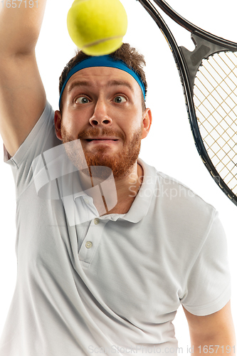 Image of Funny emotions of professional tennis player isolated on white studio background, excitement in game