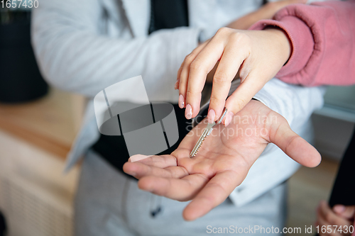 Image of New property owners, young couple moving to new home, apartment, close up