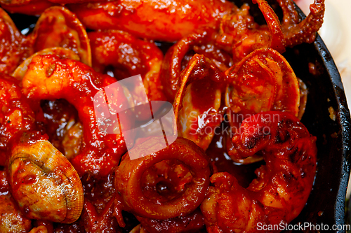 Image of fresh seafoos stew on an iron skillet