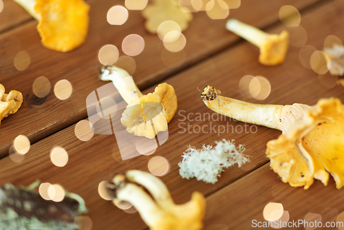 Image of chanterelles on wooden background