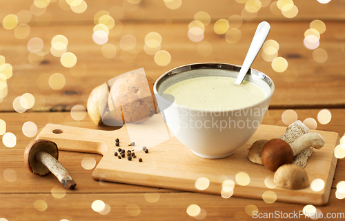 Image of mushroom cream soup in bowl on cutting board