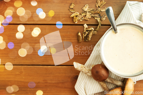 Image of mushroom cream soup in bowl on cutting board